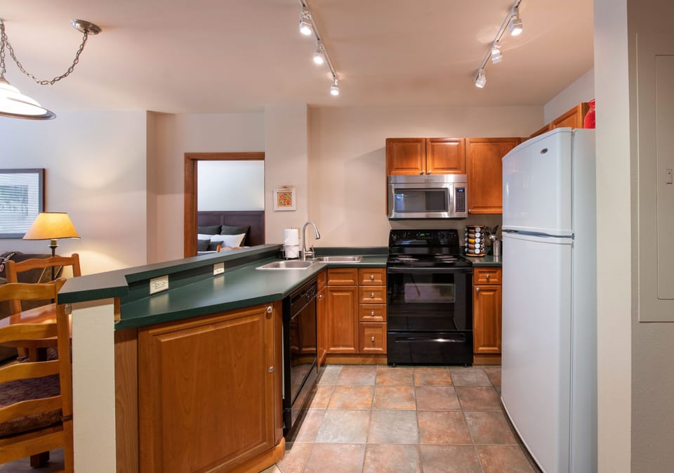 Condo, 2 Bedrooms | Private kitchen | Coffee/tea maker, fridge, oven, toaster