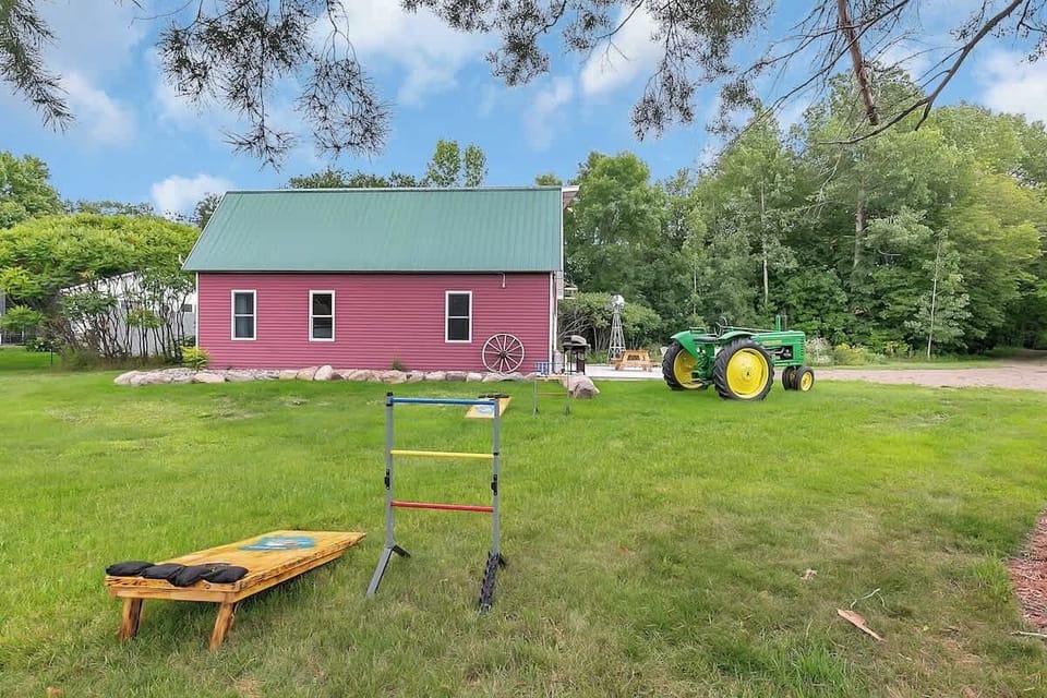 Family/friends pictures by the Tractor! Propane grill, ladder ball, and Bag boards for your use!