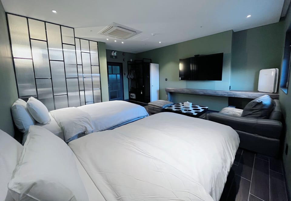 Family Studio | Down comforters, in-room safe, individually decorated