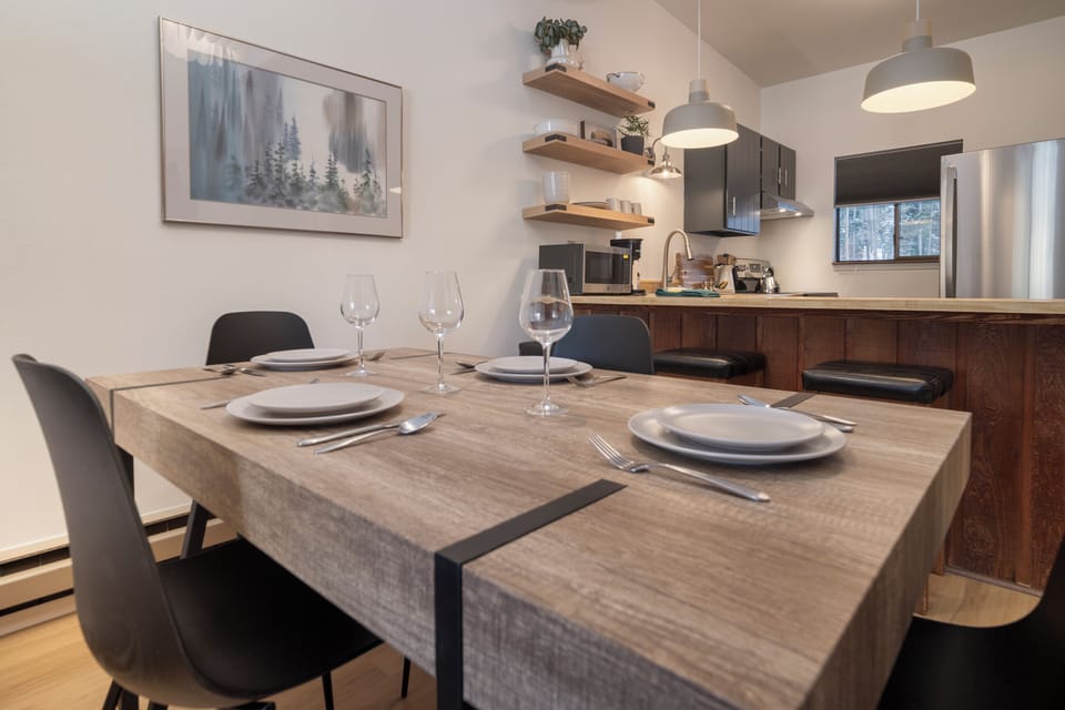 Your open-concept dining and kitchen area feels like home, with warm wood tones and modern touches perfect for sharing meals together.