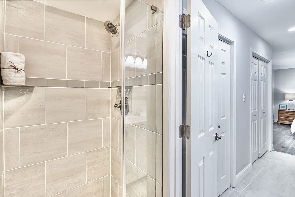 The master shower has specialty tile work with a beautiful frameless glass door.