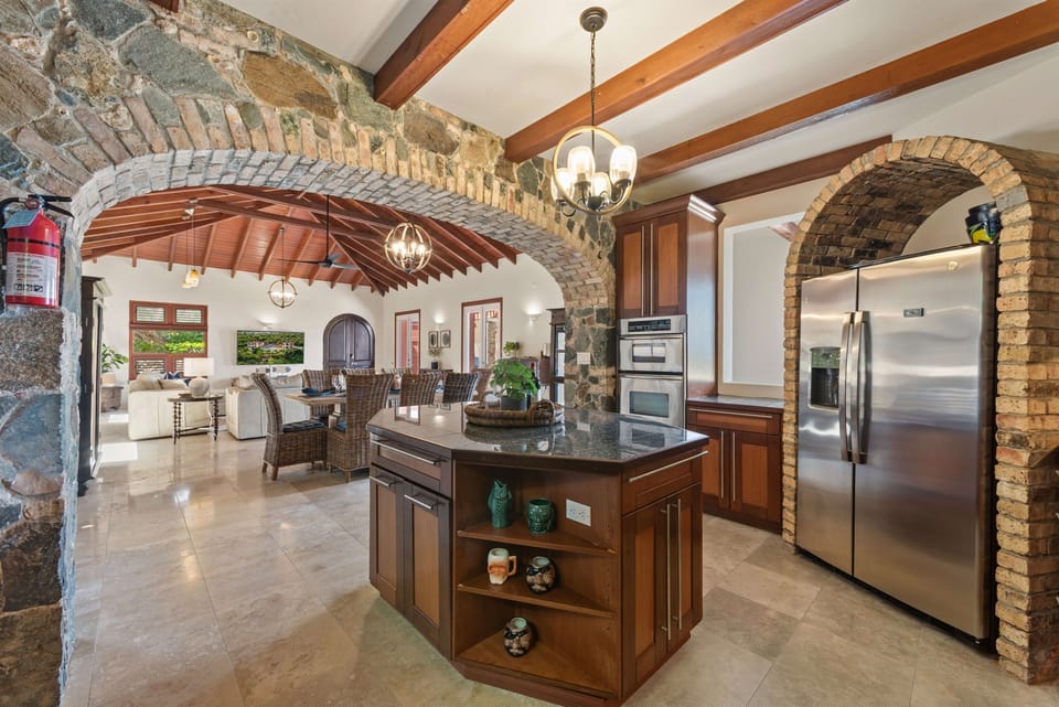 The Gourmet Kitchen with Stainless steel appliances, Six burner gas cooktop, convection oven and wine/beverage refrigerator