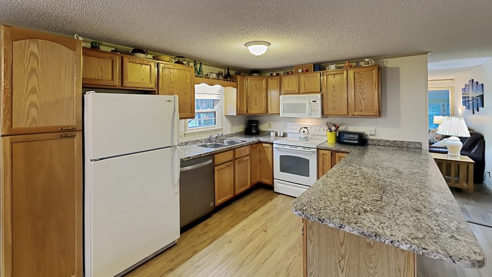 A small, but efficient kitchen has everything you need.  Drip coffee maker and a tea kettle for your mornings!