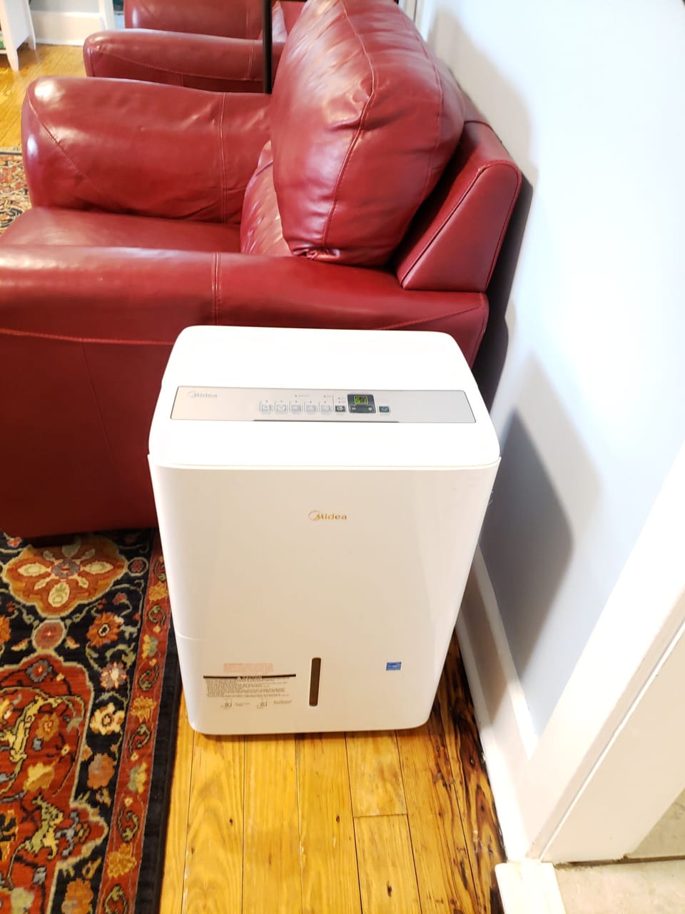 Dehumidifier helps with the air conditioning. Empty when full.