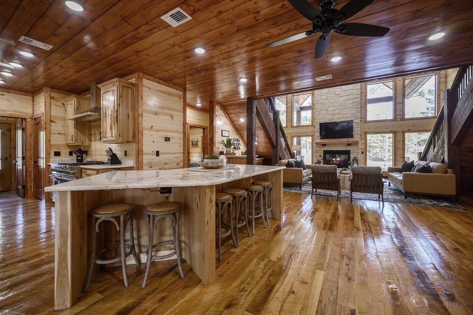 The kitchen island has 6 bar stools and the table seats up to 12 as well.