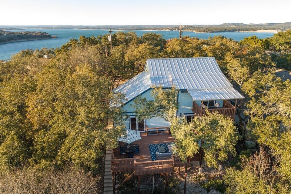 Ideally located with lake views from the front, and hill country views from the back!