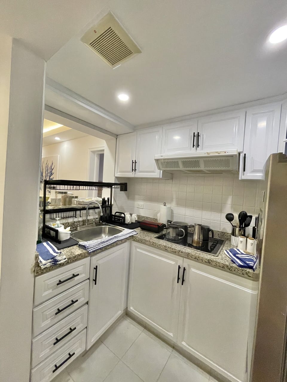 Kitchen with Stove Top Refrigerator Portable Oven Microwave Pots and Pans