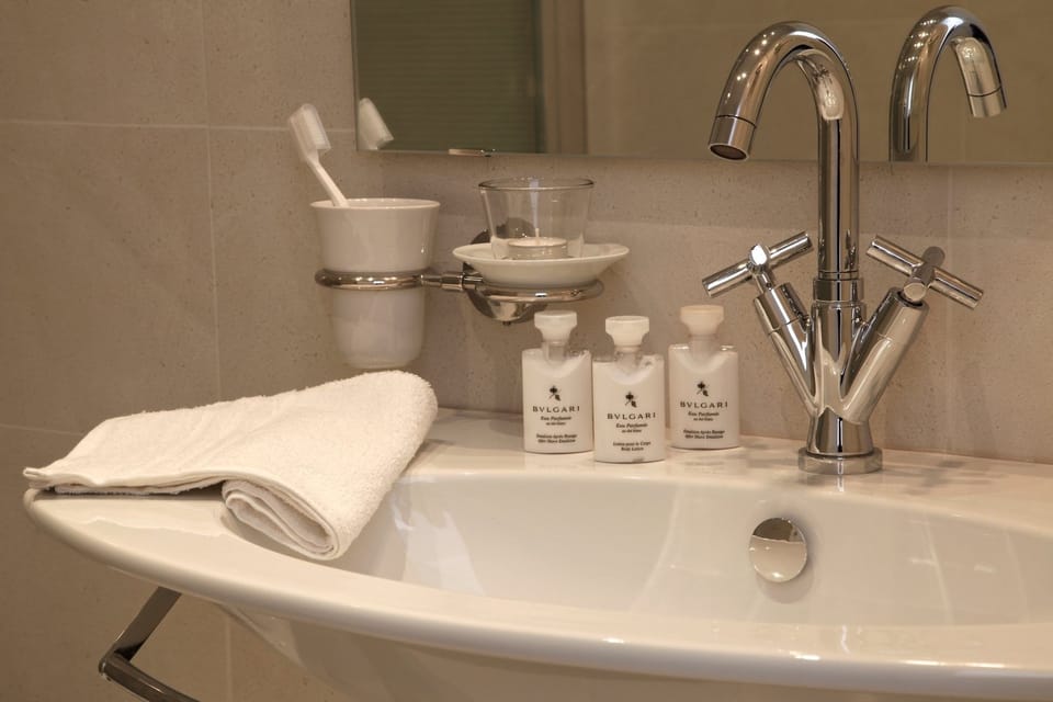 Shower, rainfall showerhead, designer toiletries, hair dryer