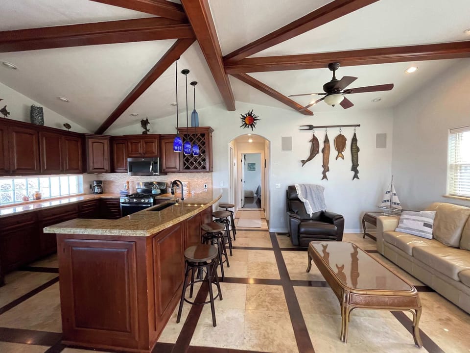 Take in the water view from the open living and kitchen space