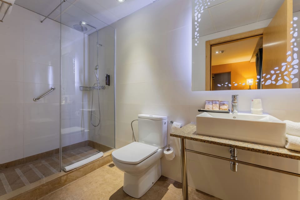 Eco-friendly toiletries, hair dryer, towels, soap