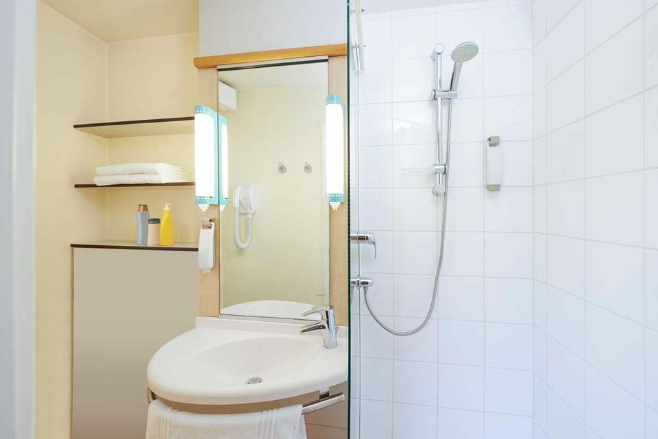 Shower, eco-friendly toiletries, hair dryer, towels