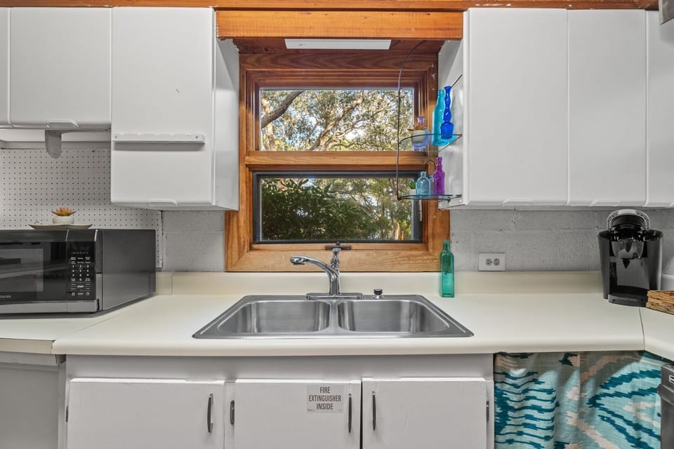 View of back yard over kitchen sink.