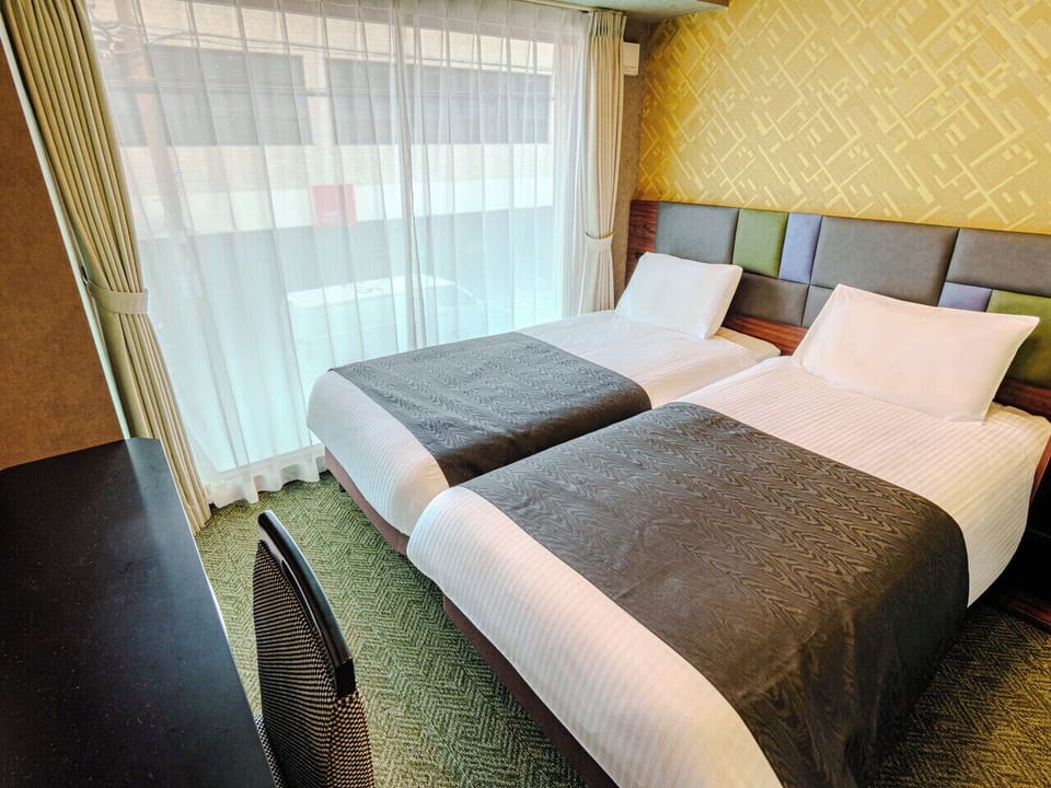 Twin Room, Non Smoking | Down comforters, desk, WiFi (free), bed sheets