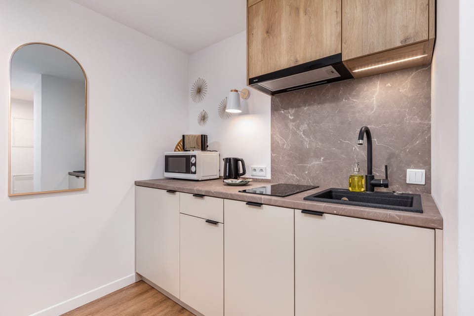 The fully equipped kitchenette includes everything you need for a home-cooked meal.