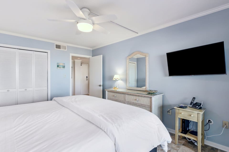 Closet and Dresser in Bedroom for Your Storage Needs. Wall Mounted TV as well.