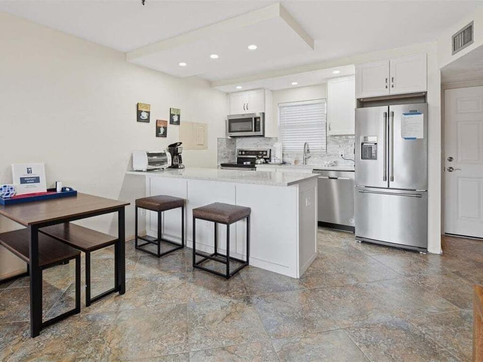 kitchen with breakfast bar and dining table