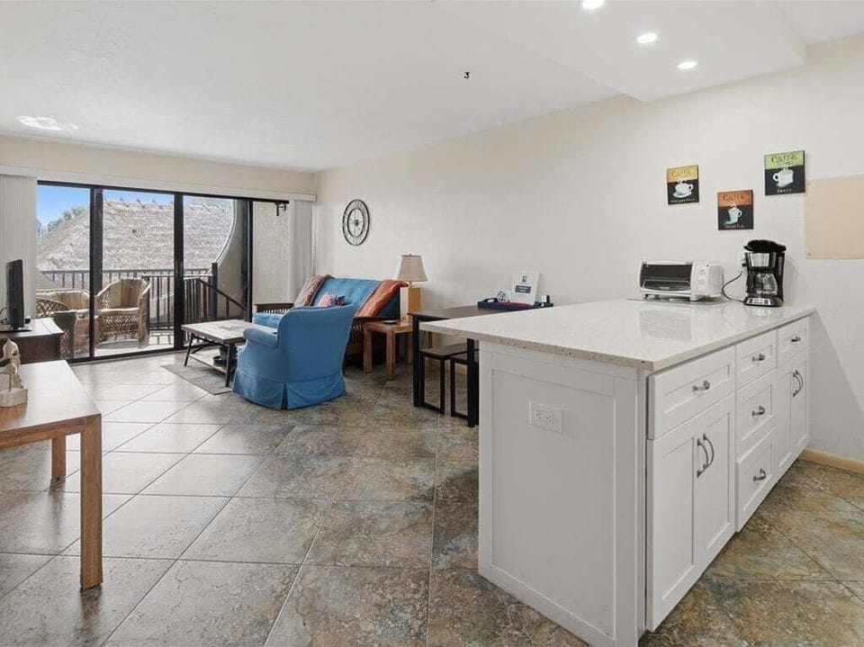 living and kitchen area with breakfast bar