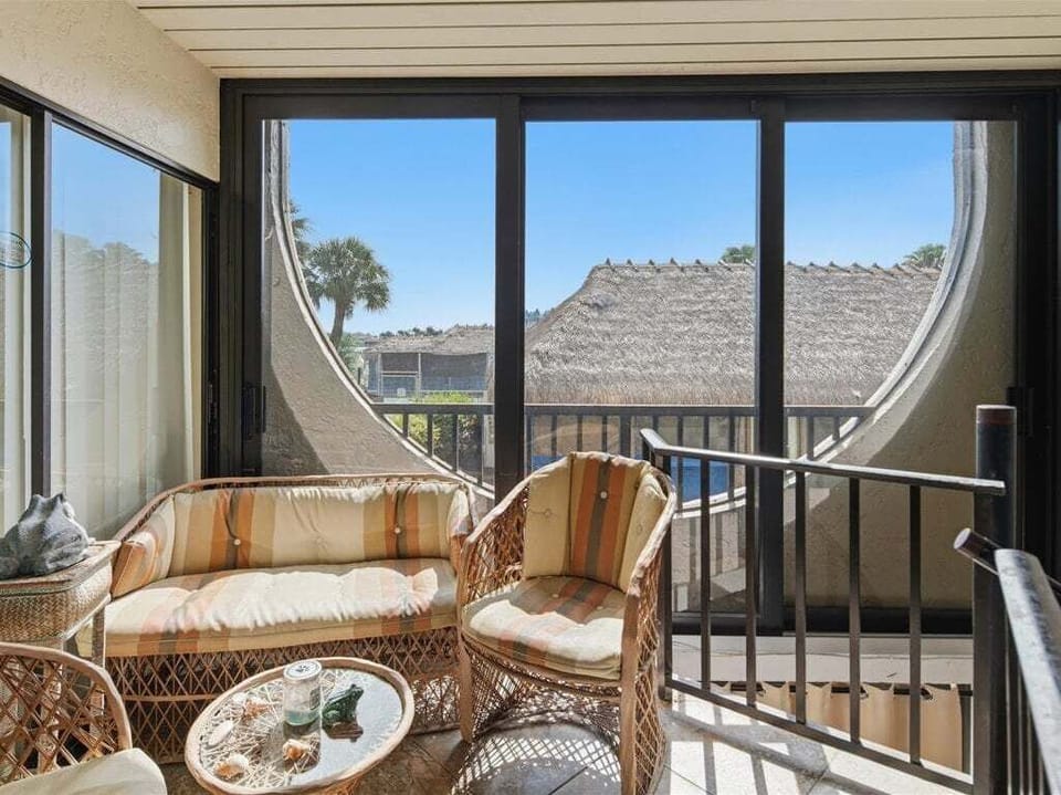 screened in back patio with stairs to cabana downsatirs