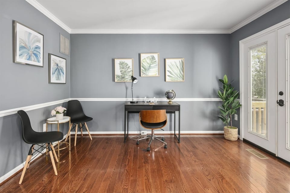 Private workspace equipped with a table lamp & under desk outlets