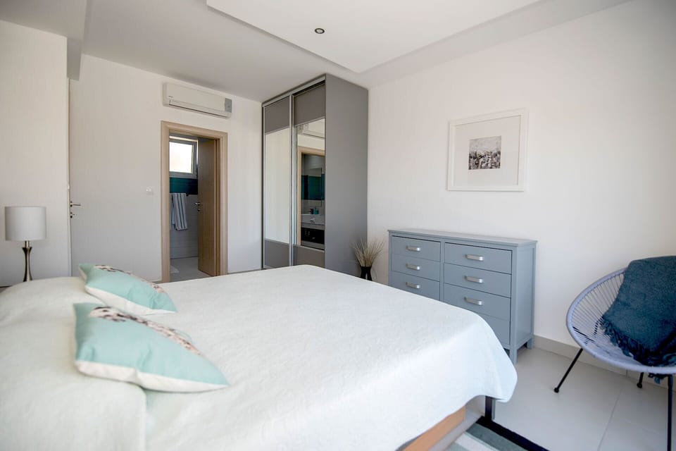 Master bedroom on the first floor with wardrobe, AC and ensuite bathroom