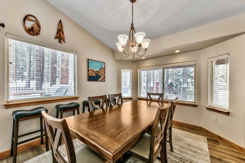 Gather around this warm dining space where natural light pours through the windows, creating the perfect setting for memorable meals with loved ones.
