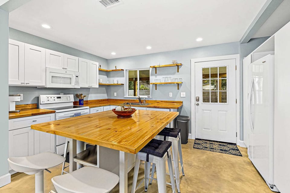 Sit up at the beautiful, polished breakfast bar and keep the chef company