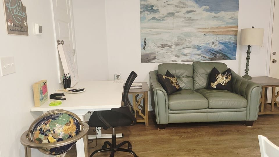 dedicated work space. swivel chair. electric adjustable desk, standing or sit