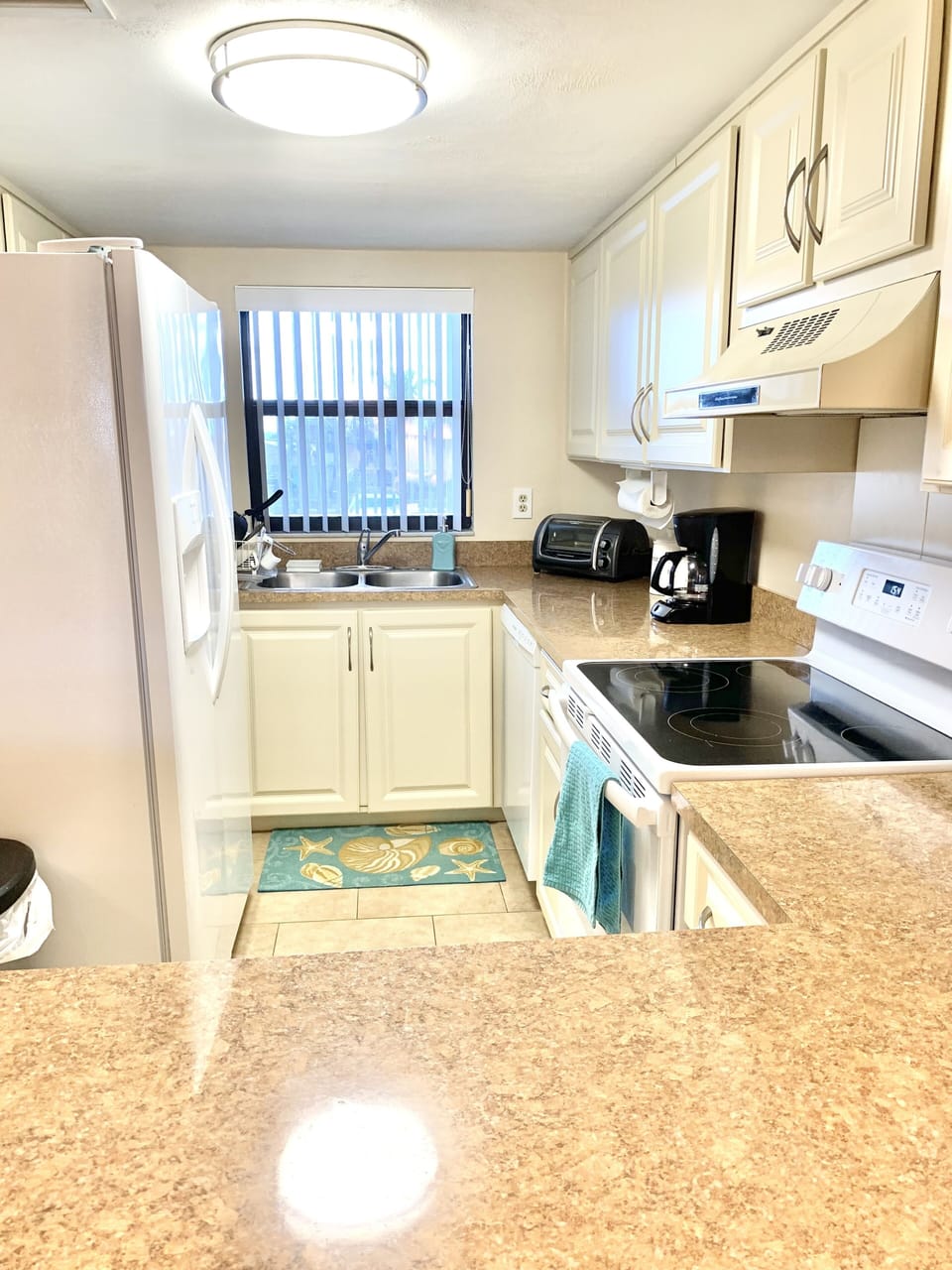 Fully stocked kitchen with new appliances.