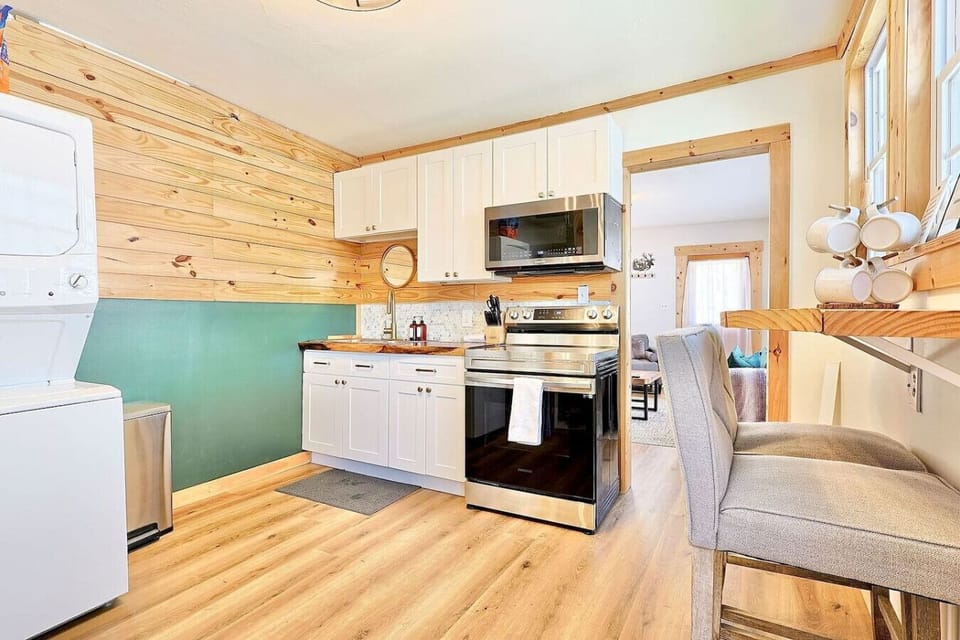 Kitchen: Culinary adventures await in this bright, stylish space with modern appliances and rustic charm!