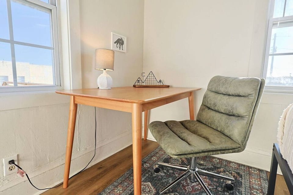 Workspace Retreat: Bright and inviting desk with ergonomic chair, perfect for productivity!