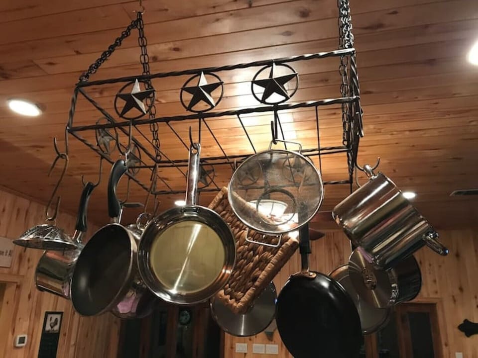 The Texas-themed pot rack has plenty of room for pots and pans of every size.