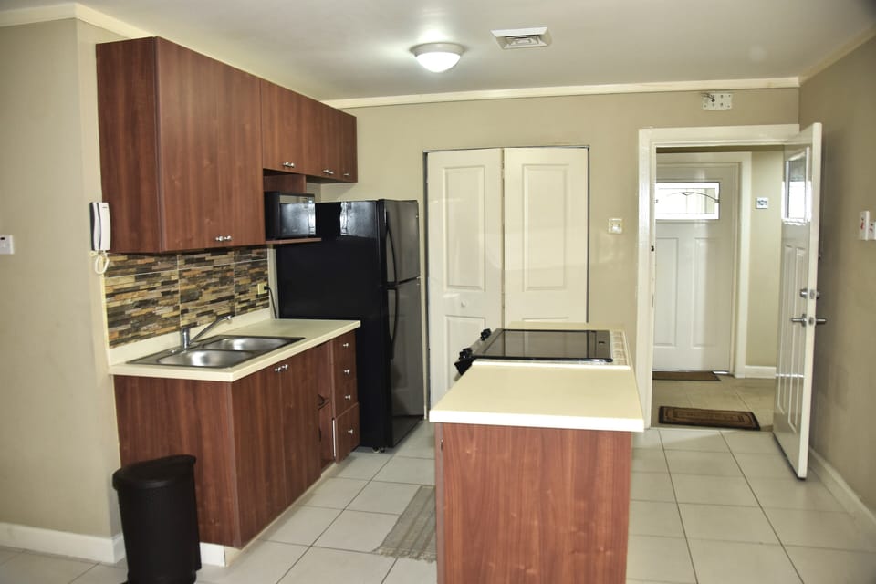 kitchen with freight stove microwave kettle toaster