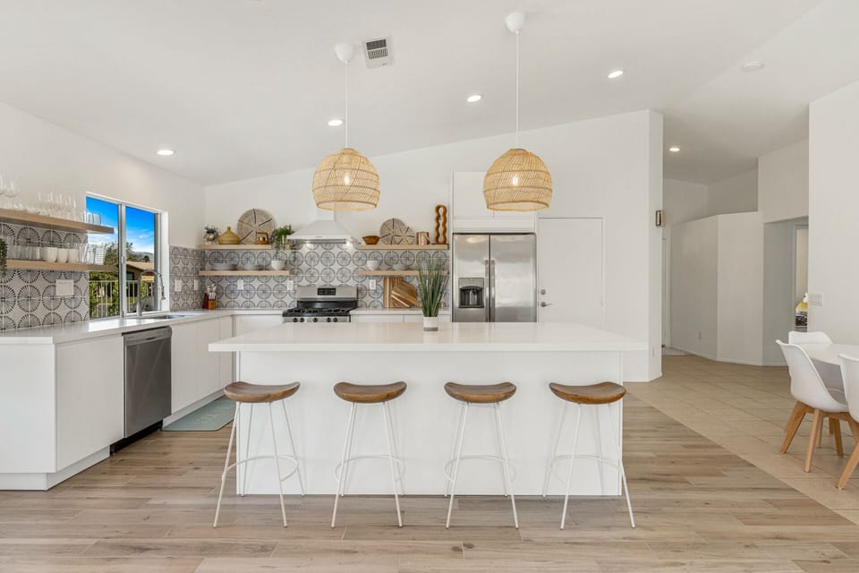Fully stocked kitchen w open shelving for ease of use