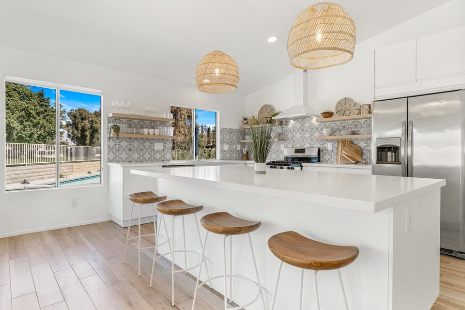 Fully stocked kitchen w open shelving for ease of use