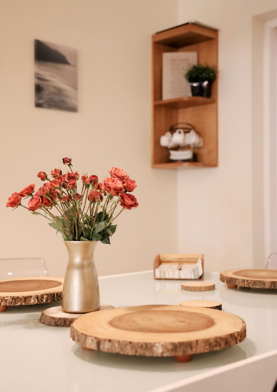 Bright dining room with stylish table and cozy, elegant décor.