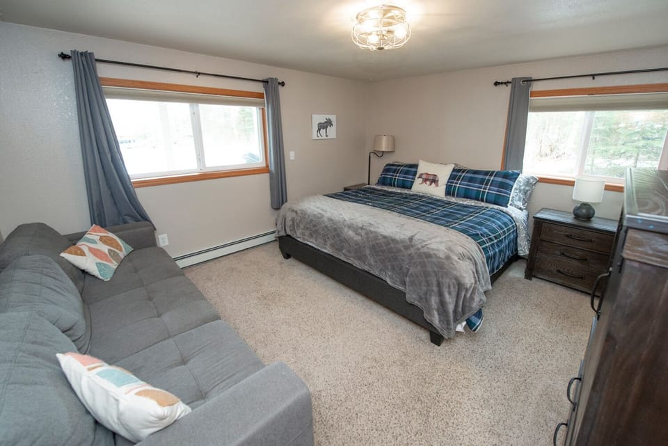 King Size master bedroom with extra sleeper sofa to accommodate larger groups!
