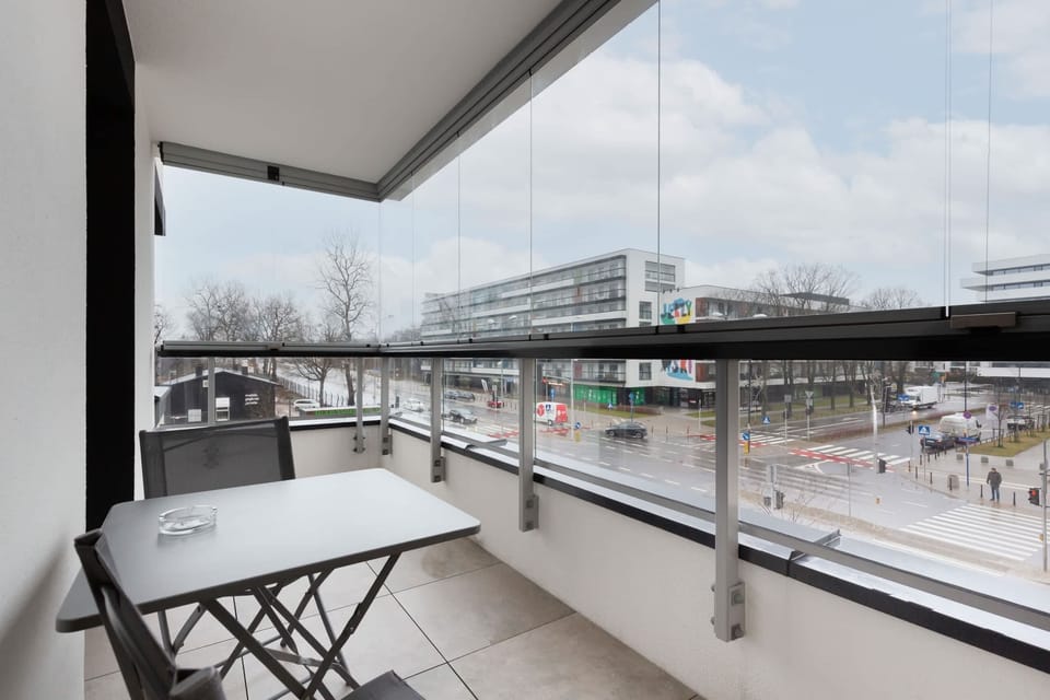 The furnished, spacious balcony is conducive to spending time outdoors.