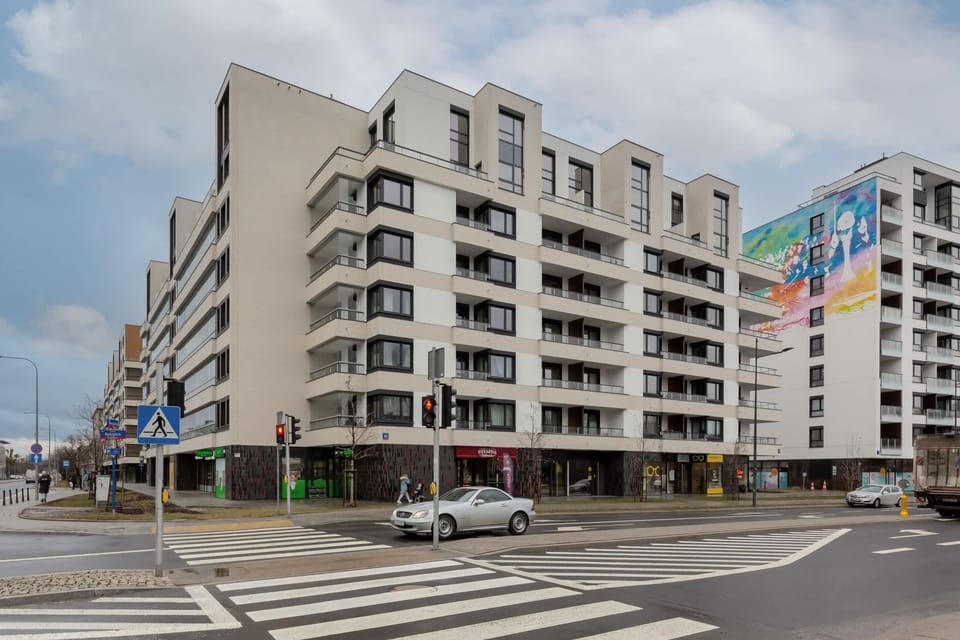 A modern five-storey building in which the flat is located.