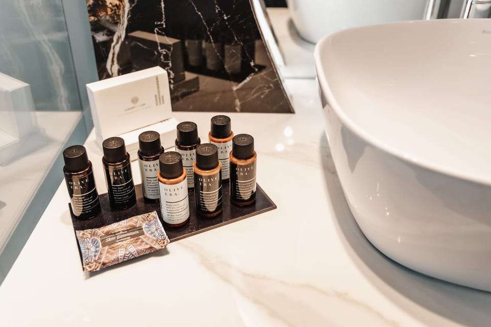 Junior Studio Suite | Bathroom | Shower, designer toiletries, hair dryer, bathrobes