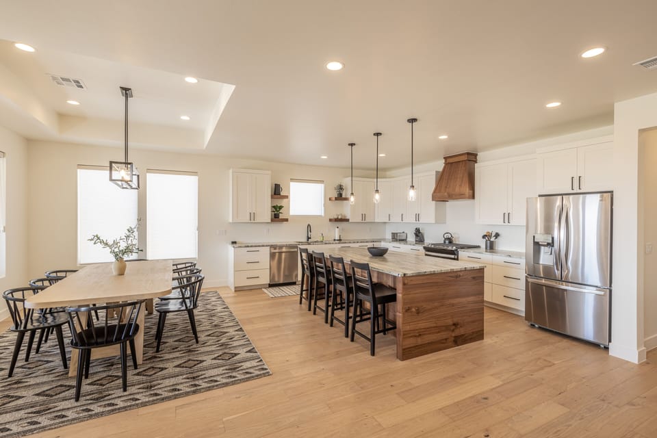 Kitchen island and dining table view - With an open and spacious floor plan, the Dining Room and Kitchen can accommodate meal preparations for groups large or small.