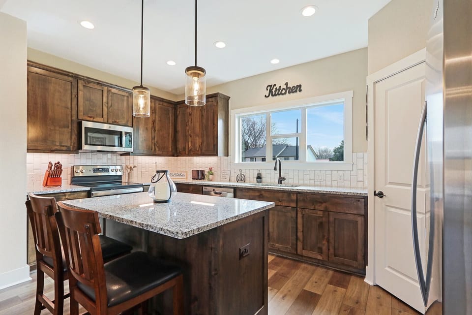Full kitchen with stainless steel appliances