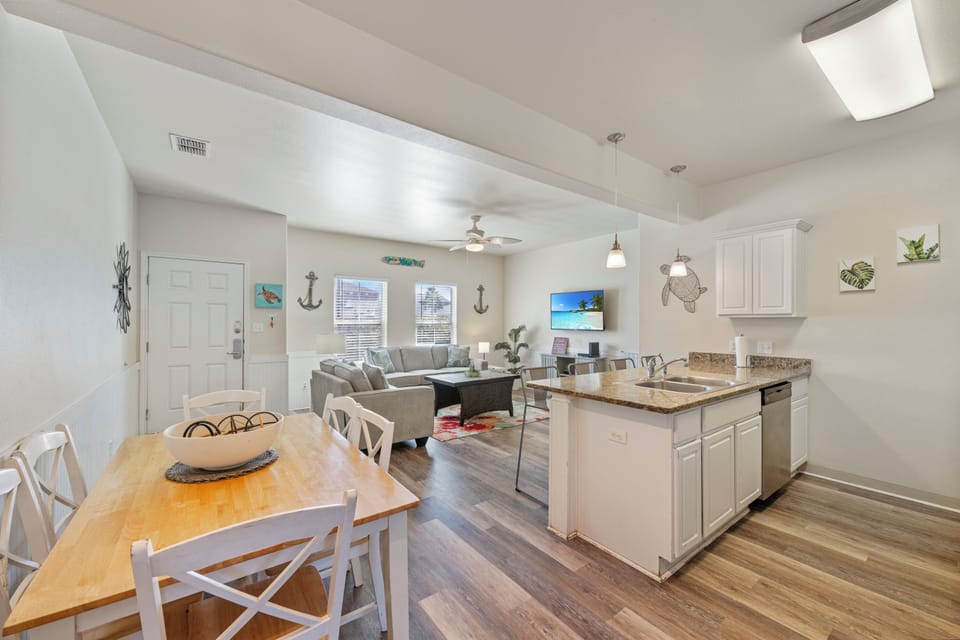 Step into your bright, coastal-themed retreat with open living spaces, modern kitchen, and charming nautical touches throughout.