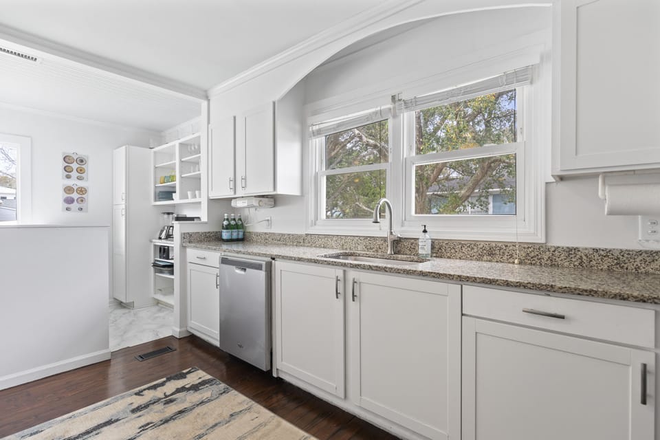 Inviting Kitchen with ample counter space and fully equipped kitchen — steps from the beach