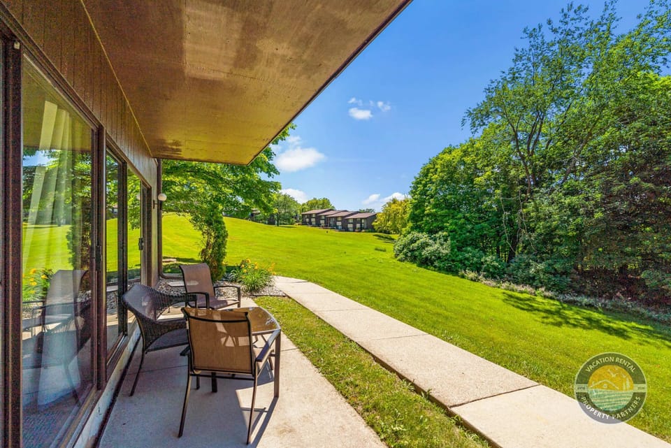 Step outside to a private patio overlooking peaceful green scenery and open space. Enjoy morning coffee, evening drinks, or quiet time in the fresh air while still being close to Lake Geneva’s dining, shopping, and attractions.