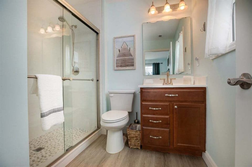 Spacious vanity and full bath accommodations for added guest convenience.