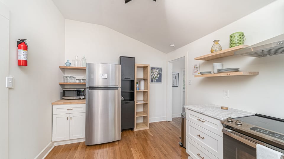 Refrigerator has ice maker.  Electric stove