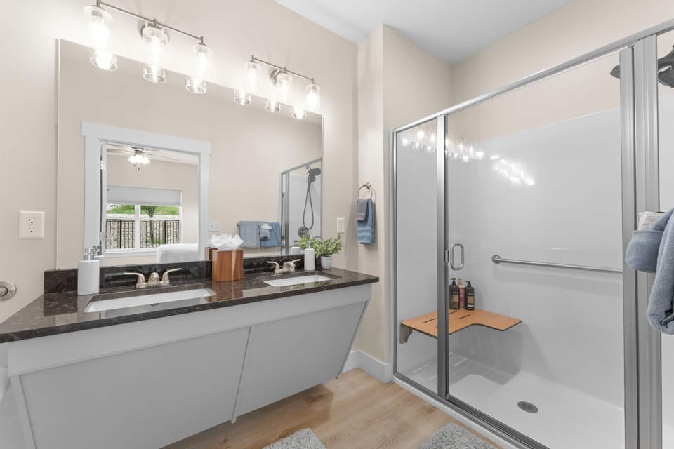 Bathroom 1 has double sinks and a walk-in shower!