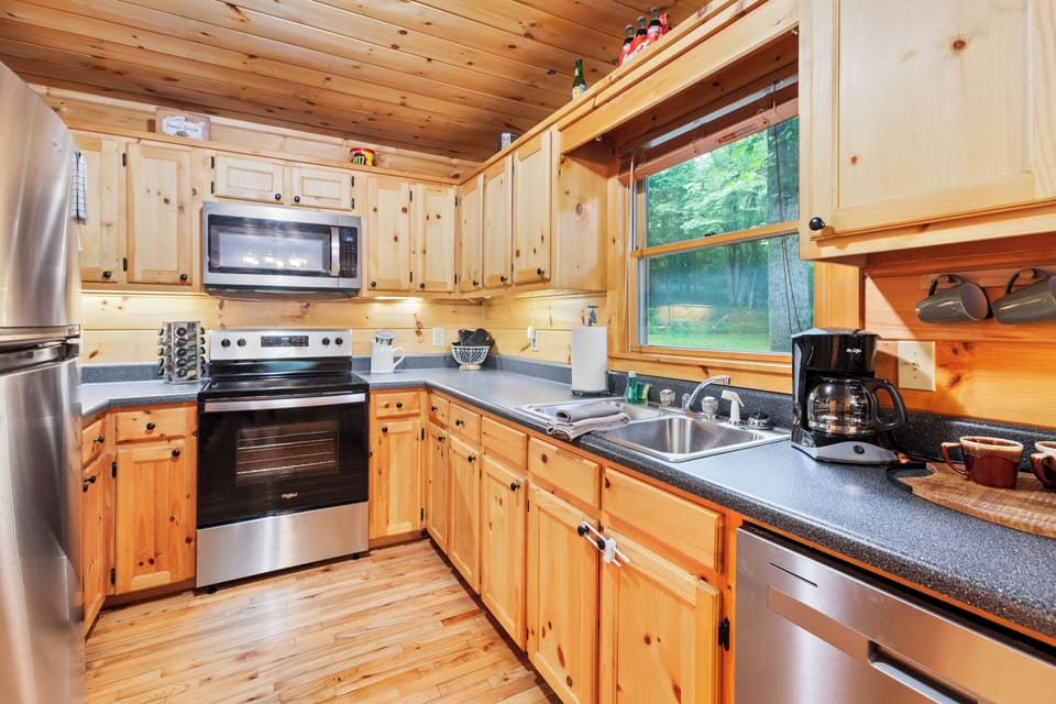 Enjoy modern appliances surrounded by warm wood accents and stunning views!