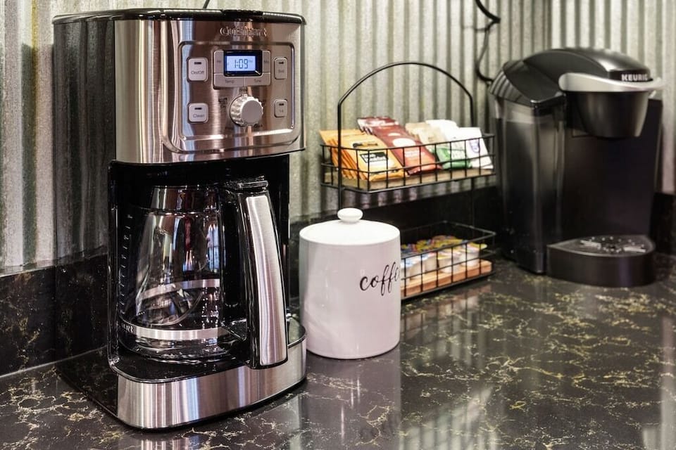 Coffee bar w/ Ninja brewer, Keurig, French press & supplies ready.