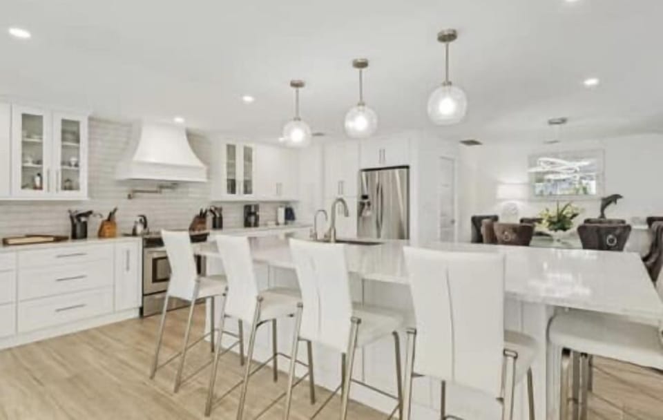 KITCHEN OF YOUR DREAMS WITH AMAZING VIEWS OF POOL AND WATER FRONT.